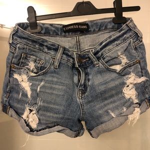Mid-rise ripped medium wash cuffed jean shorts